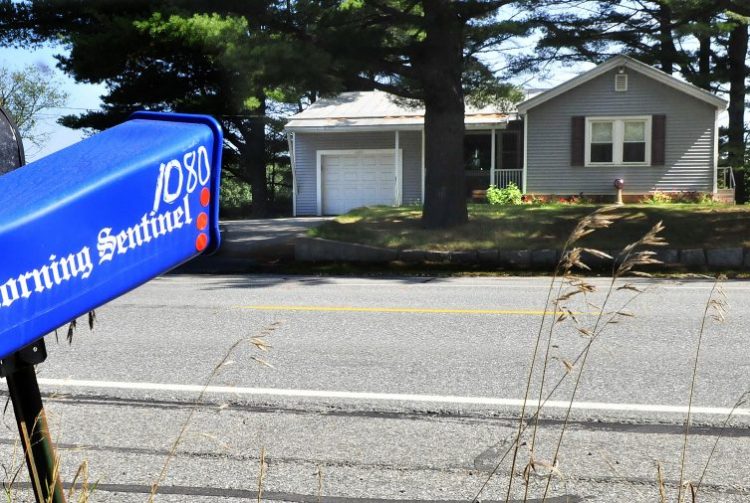 The home of Charles Atwood is seen across the street from his mailbox and newspaper tube Thursday on U.S. Route 201 in Skowhegan. Atwood died after getting struck by a box truck early Tuesday morning while crossing the roadway.