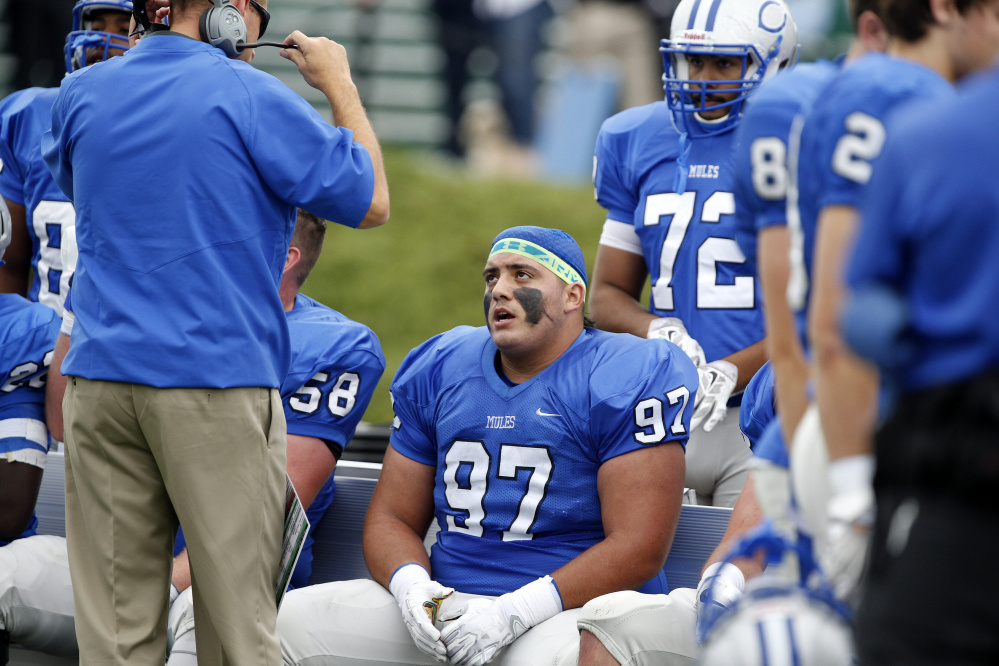 Colby defensive tackle Sam Gomez takes a breather during a game last season.