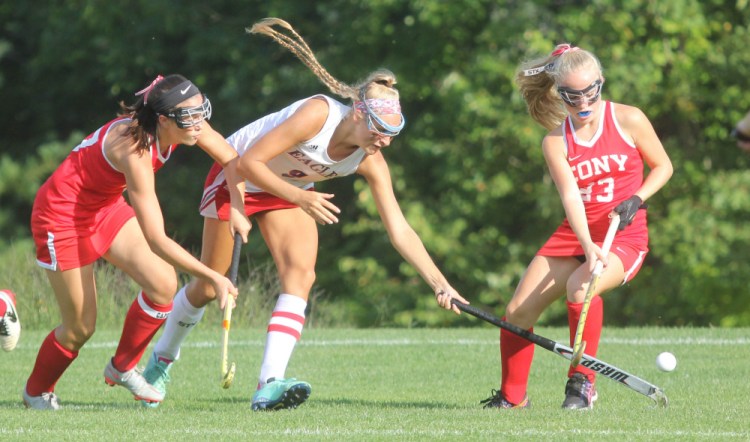 Messalonksee High School's Ally Turner, center, fights for the ball with with Cony High School's Olivia Varney, left, and Anna Reny during first-half action in Oakland on Thursday.
