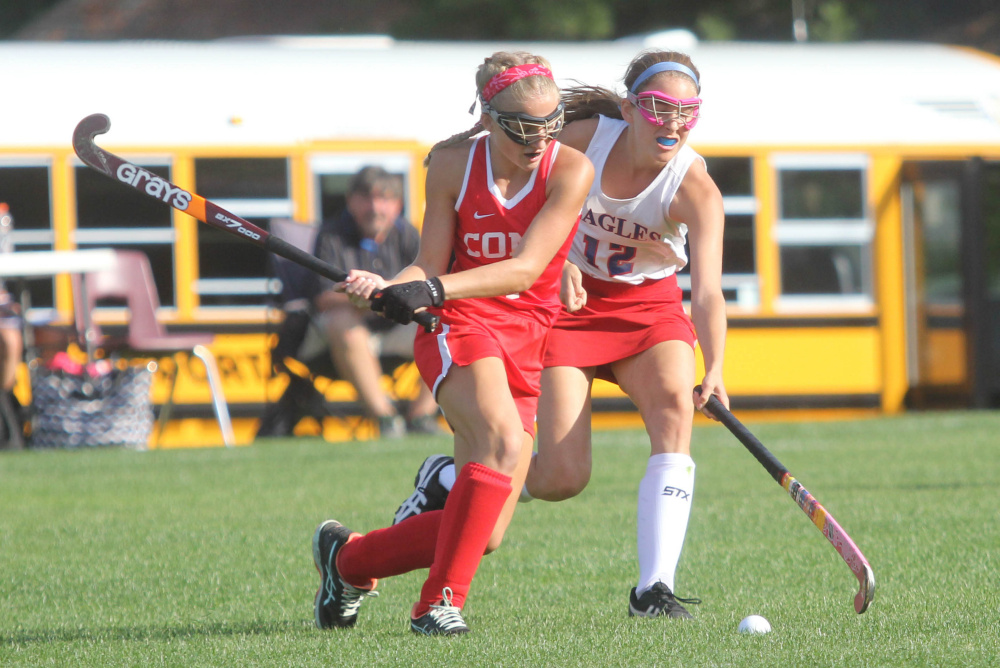 Messalonskee High School's Sarah Kohl (12) tries to take the ball from Cony High School's Julia Reny during first-half action on Thursday in Oakland.