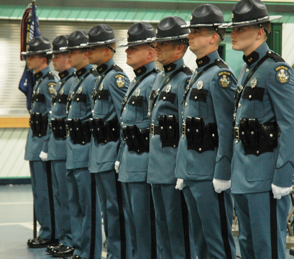 The eight state troopers who graduated on Friday from the Maine Criminal Justice Academy in Vassalboro now will ride with senior troopers before patrolling on their own.
