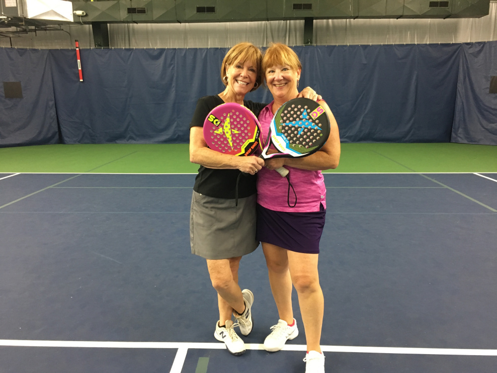 From left, Sally Read and Christina Rao display the new types of tennis rackets used in POP Tennis, which will be demonstrated Sept. 29 at A-Copi Tennis and Sports Center in Augusta.