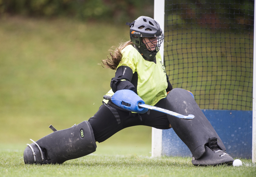 Winslow High School goalie Cassie Demers (28) makes a save against Lawrence High School in Fairfield on Saturday.