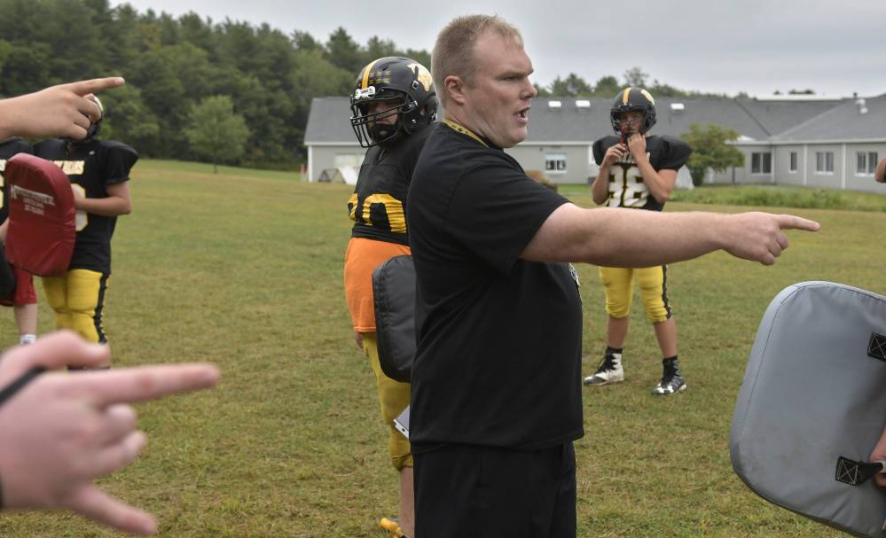 Maranacook football coach Walter Polky directs his team at practice Wednesday in Readfield.