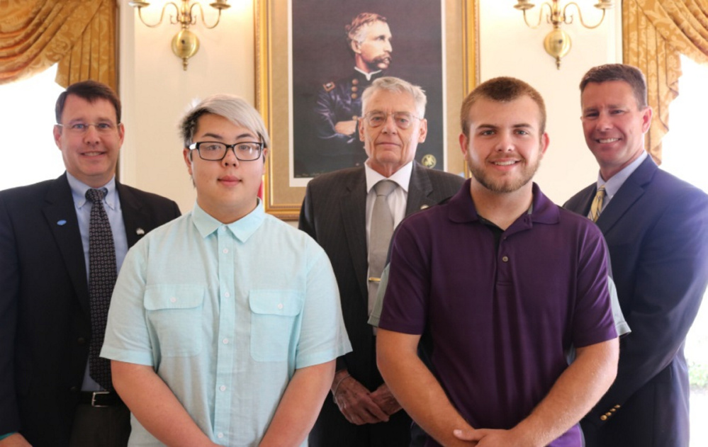 Andrew Silsby, president and CEO of Kennebec Savings Bank, left, with Nathan Hyunh, Robert Fuller, Corbin Dostie and Amos Byron, vice president and trust officer.