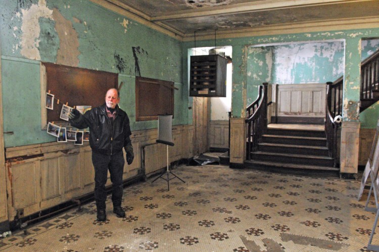 Richard Parkhurst talks about renovation plans during a February tour at the Colonial Theatre in Augusta.