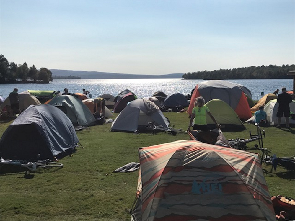 Participants in the 2017 BikeMaine event set up tents in Rangeley's Town Park during a three-day layover.
