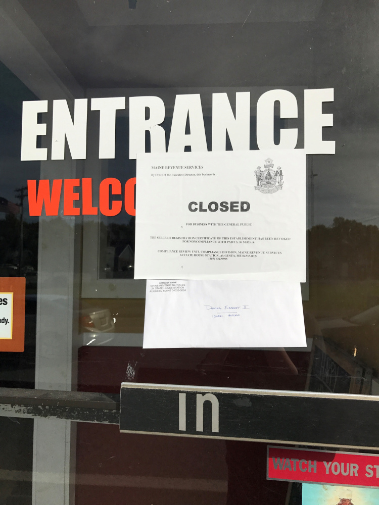A sign on the front door of the Dancing Elephant II states that the restaurant was closed to business with the public by the Maine Revenue Service for noncompliance with tax requirements.