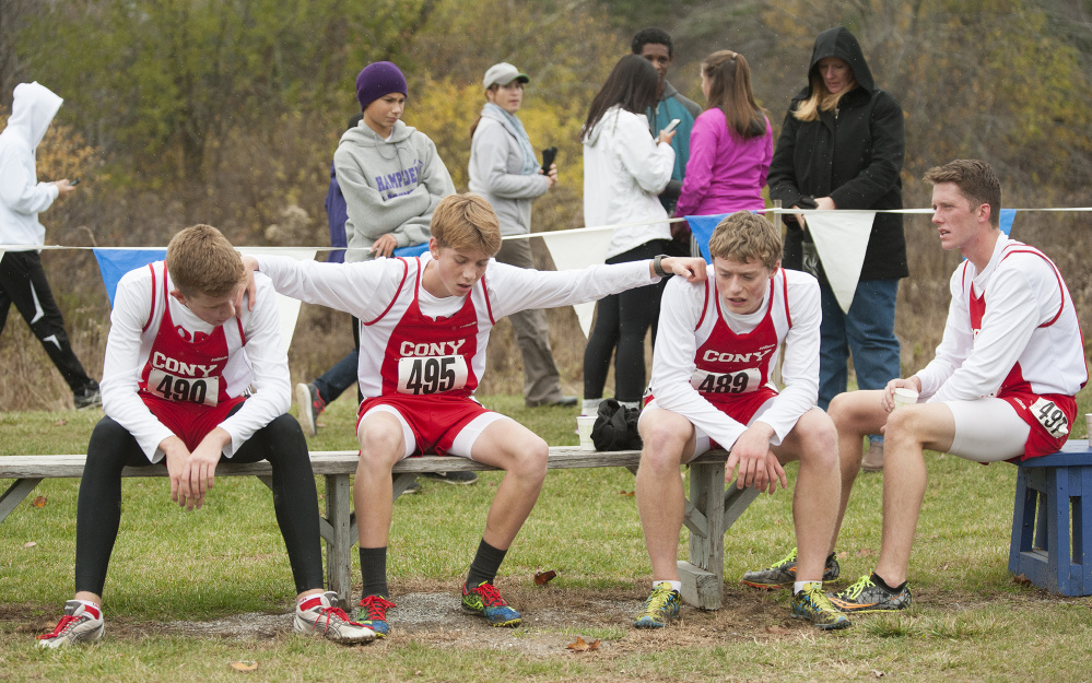 Cony's Alex Farkas, Myles Quirion, Aaron Emerson and Jack Wroten rest after the Class A boys Northern regional cross country championship last season in Belfast. The Rams are off to a good start this season.