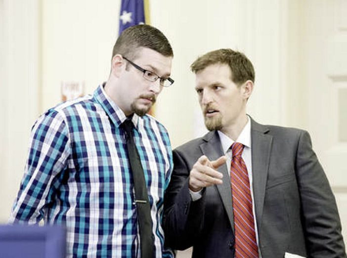 Timothy Danforth, left, talks with his co-counsel, Jeffrey Wilson, prior to the start of Danforth's murder trial in Franklin County Superior Court on Monday.