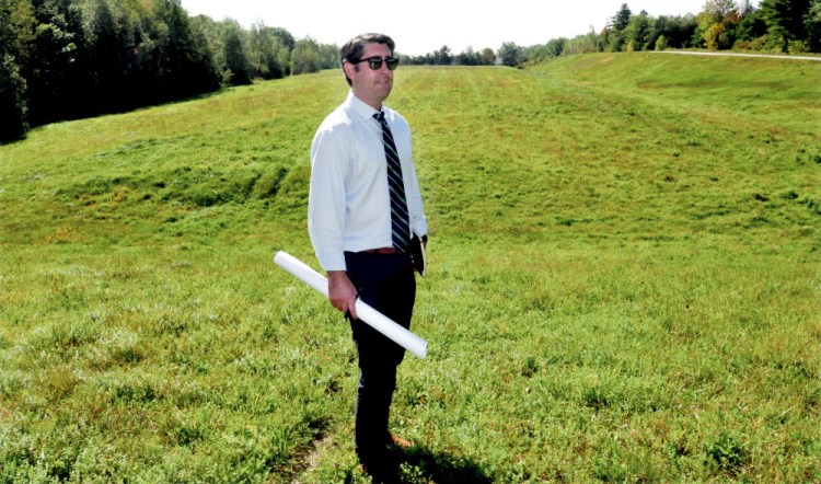 Garvan Donegan, of the Central Maine Growth Council, has worked with the town of Fairfield and Gizos Energy on a solar energy project planned for the town's closed landfill on Eskelund Drive, where the sun shone brightly Wednesday.