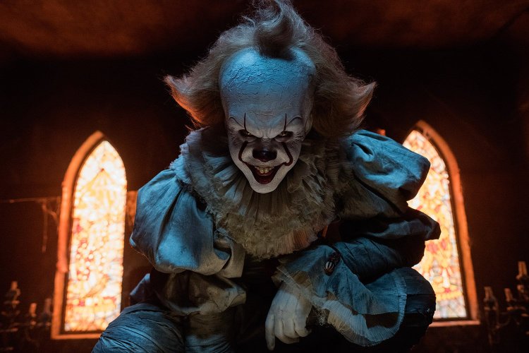 Bill Skarsgard plays the terrifying clown Pennywise in a scene from "It." He'll reprise the role in the sequel, due out in September 2019.