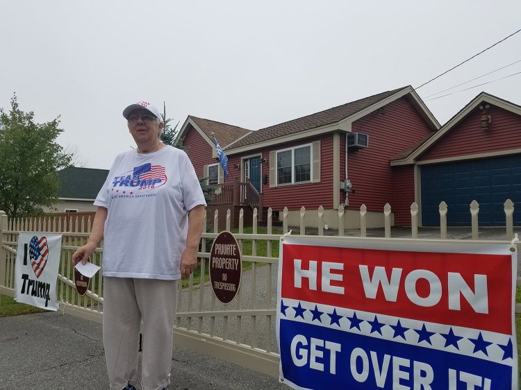 Susan Reitman of Seavey Lane in Rockland has said she won't take down the signs on her property and won't pay a fine for allegedly violating a town ordinance regarding the size and number of signs on private property.
