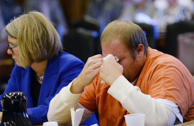Joshua McNally wipes away tears after speaking at the Cumberland County Courthouse where he was sentenced in connection to the motor vehicle death of Lake Region Middle School science teacher Adam Perron.