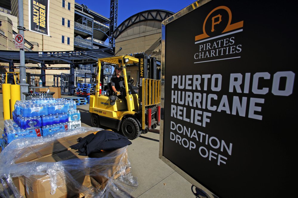 Donations pile up Monday outside PNC Park in Pittsburgh, where the Pittsburgh Pirates baseball team is collecting supplies for Puerto Rico. The U.S. government is reportedly planning to seek $10 billion to help recovery efforts in the storm-wracked U.S. territory.