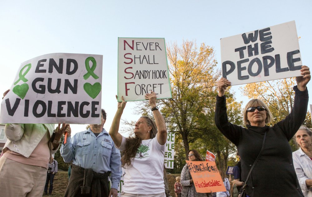 Gun control advocates demonstrate Wednesday in Newtown, Connecticut, site of the 2012 shooting at Sandy Hook Elementary that killed 20 students and six adults. Legislation introduced after that tragedy to reinstate the federal assault weapons ban failed by a wide margin.