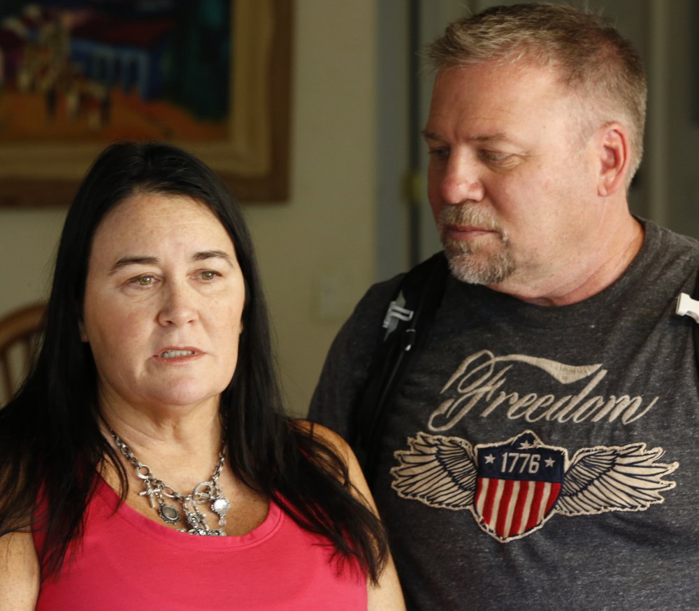 Country music fan Julie Hart, with her boyfriend, Mark Gay, recounts fleeing from the mass shooting at the Route 91 Harvest festival in Las Vegas on Oct. 1, during an interview at her family home in Anaheim Hills, Calif.