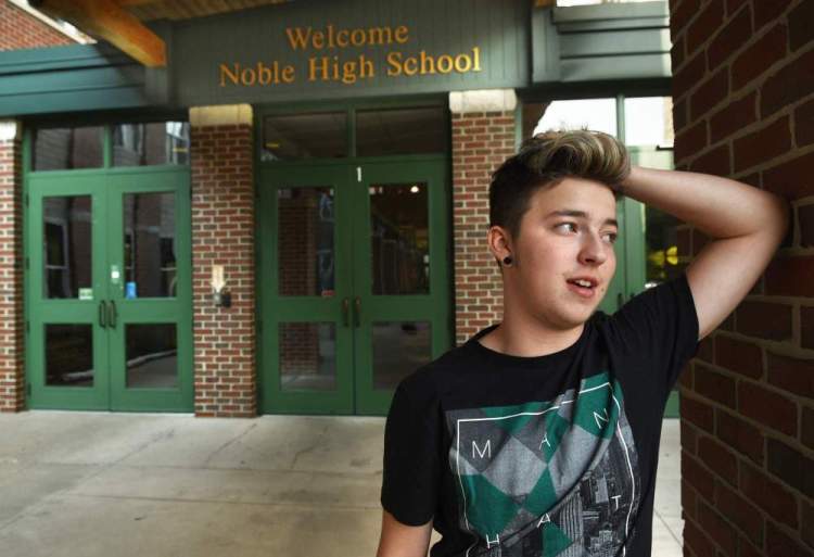 Stiles Zuschlag, a transgender teen, stands outside Noble High School in North Berwick. The teen who was crowned homecoming king at his new school says he wants to use the attention to spread love and tolerance.