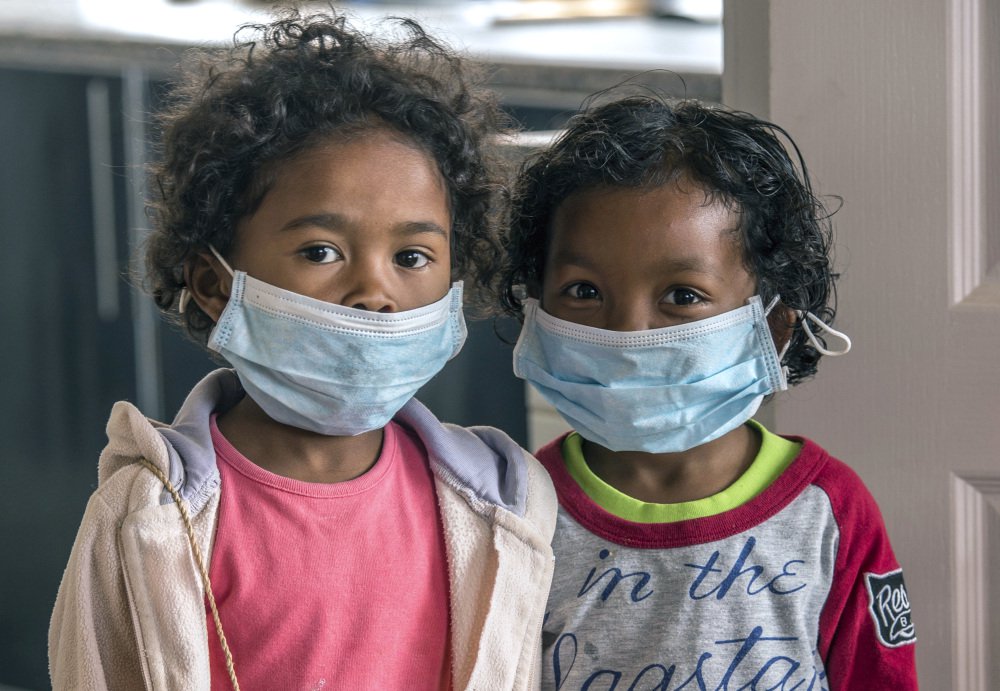 Children wear face masks at a school in Antananarivo, Madagascar. With dozens dead from a plague outbreak, the International Federation of Red Cross and Red Crescent Societies said Friday that it is deploying its first-ever plague treatment center to the island nation.