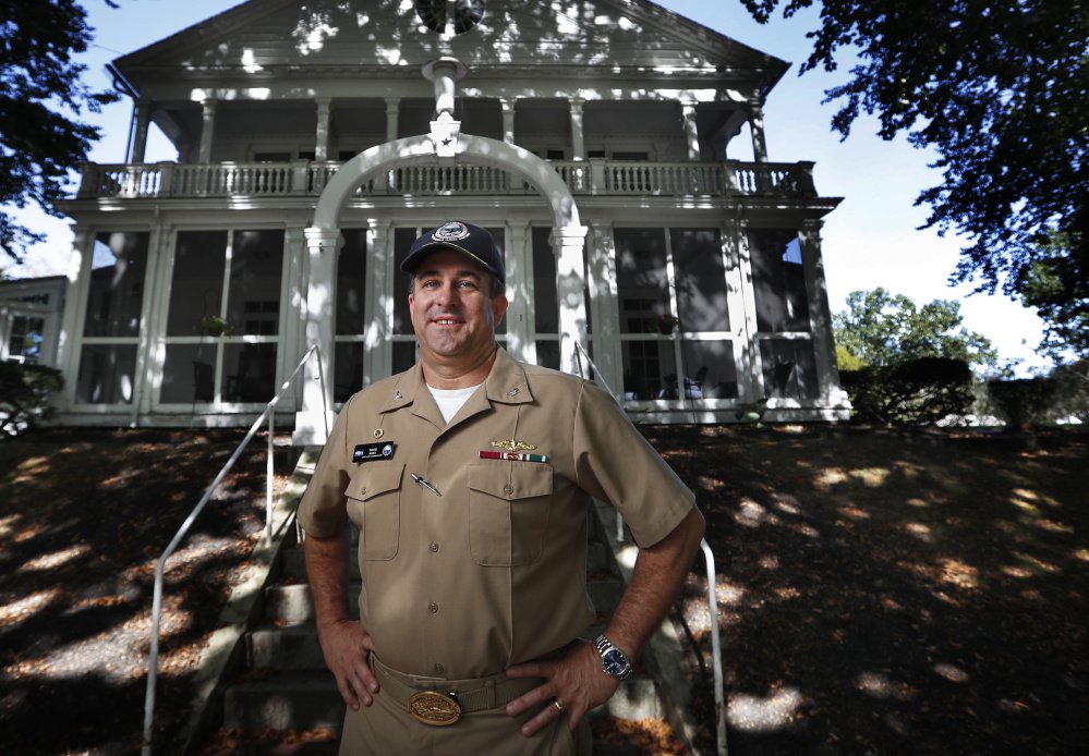 Capt. David Hunt poses in front of Quarters "A", the shipyard commander's historic residence, at the Portsmouth Naval Shipyard in Kittery.
