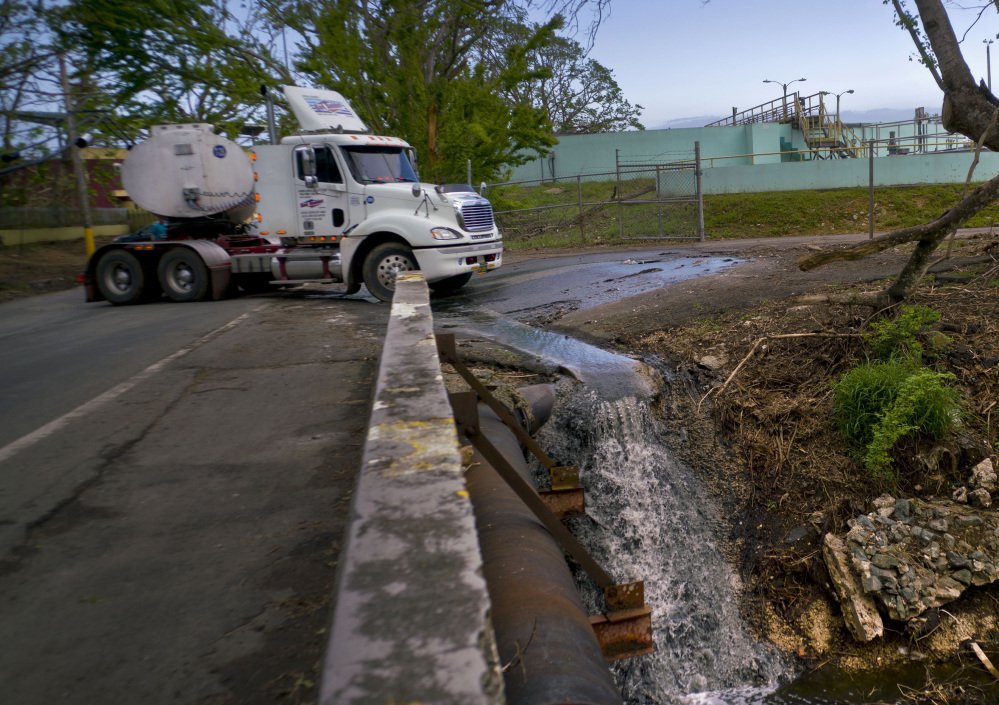 A tanker transports wastewater Thursday from a sewage plant that was left nonoperational after Hurricane Maria to a treatment plant that is working, in Dorado, Puerto Rico.