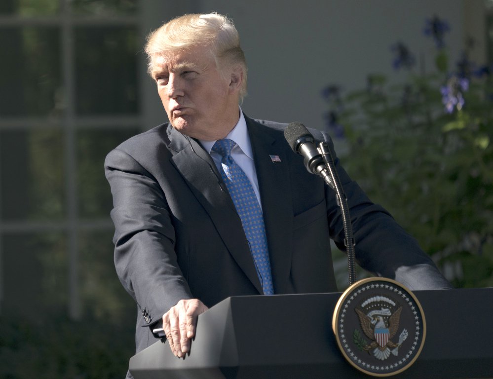 President Trump pauses Tuesday during a news conference with Greek Prime Minister Alexis Tsipras in the Rose Garden of the White House. A federal judge in Hawaii has blocked Trump's third attempt at a travel ban.