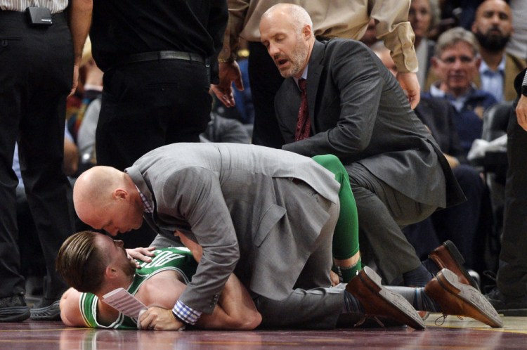 Boston Celtics forward Gordon Hawyard lays on the court after breaking his left ankle in the first quarter on Tuesday in Cleveland.