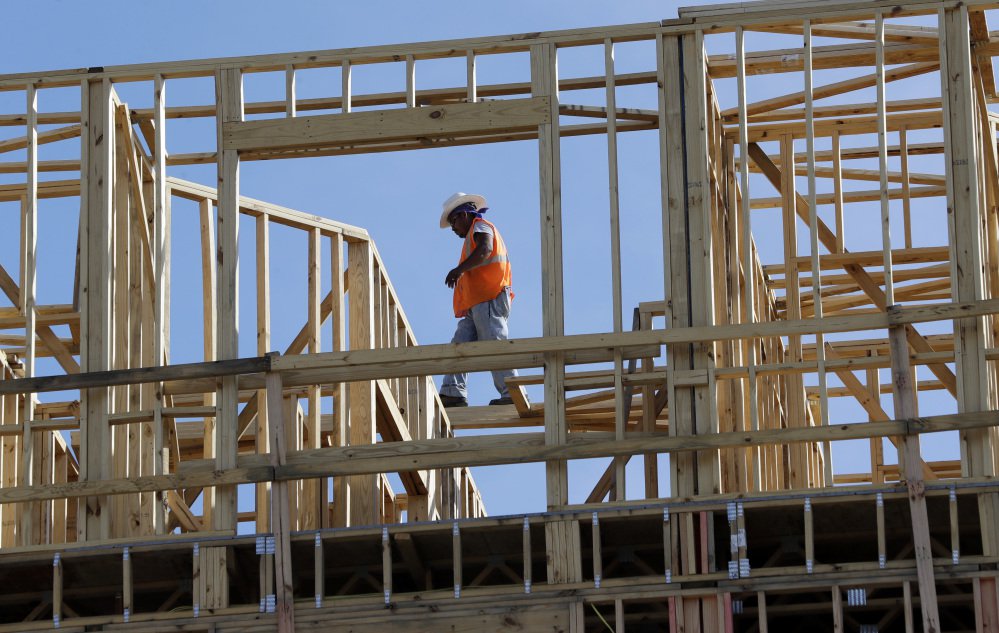 Workers build apartments in Nashville, Tenn. Friday's figures mark the first time in three years that the U.S. economy grew at a 3 percent annual rate for two straight quarters.