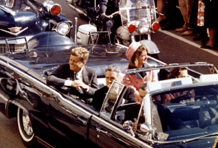 President John F. Kennedy, first lady Jacqueline Kennedy and Texas Gov. John Connally ride in a limousine moments before Kennedy was assassinated in Dallas, Texas.