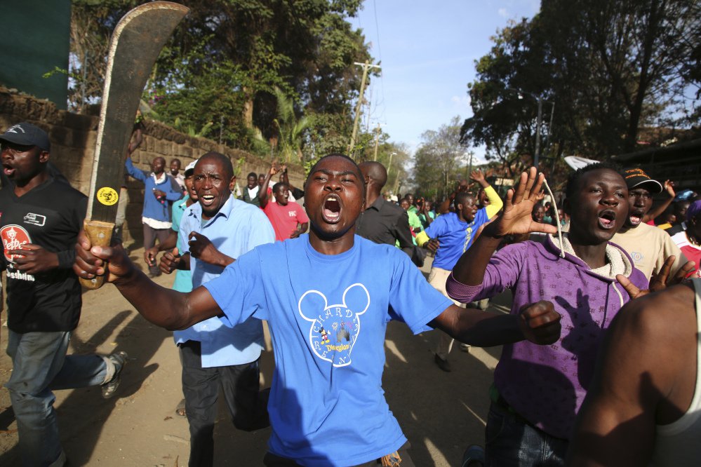 Opposition supporters take to the street in Nairobi's Kawangware area on Saturday, a day after voting was postponed in areas of Kenya where police and protesters have clashed.