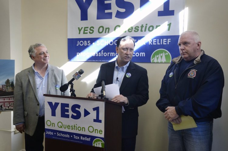 Shawn Scott speaks Tuesday in Portland. He is flanked by John Napolitano, left, and John Leavitt, regional business manager for the New England Regional Council of Carpenters. The York County casino campaign is among the most expensive ballot initiatives in Maine history.