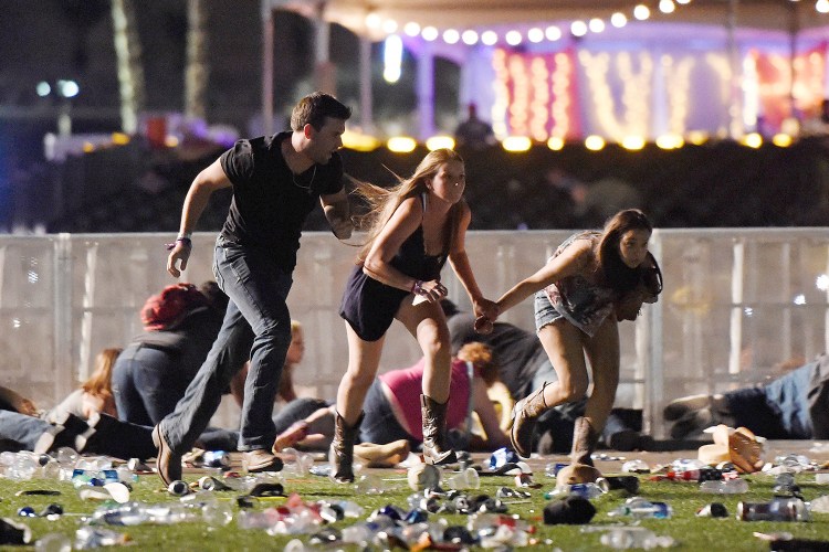 People run from the Route 91 Harvest country music festival in Las Vegas in 2017 after a gunman opened fire on the crowd.