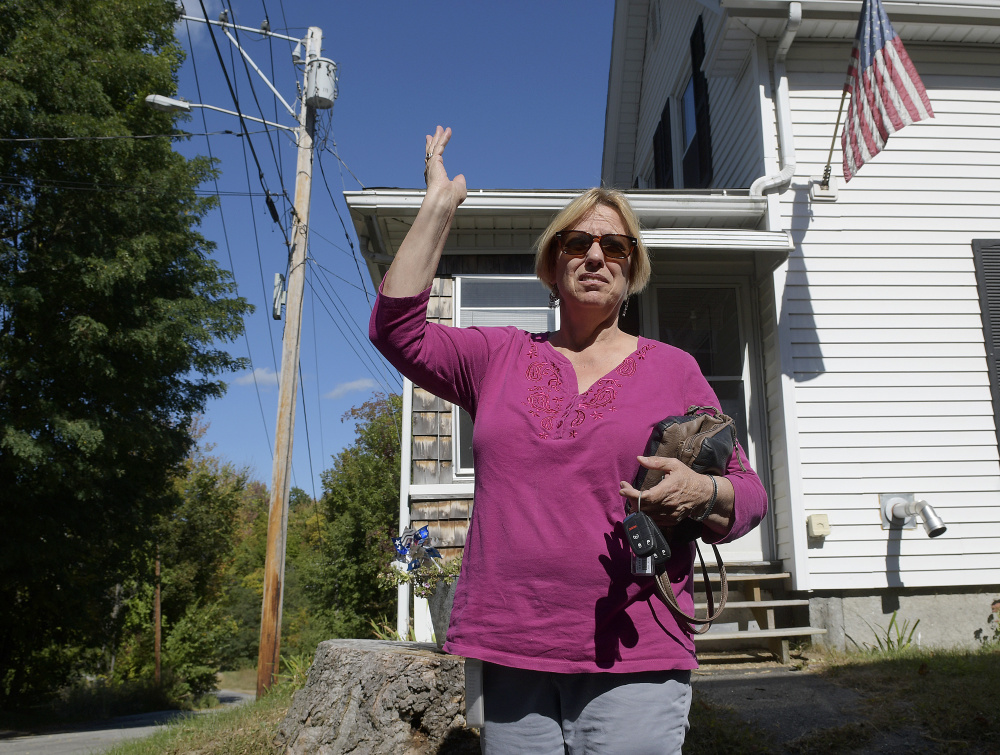 Joyce Grondin expresses concern on Monday about a proposed housing development near her home on Maple Street in Augusta.
