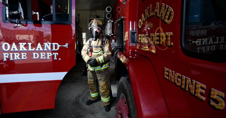 Oakland firefighter Randy Marshall stands wearing a breathing apparatus that was to be replaced this summer. The Fire Department expects to be replacing its station soon as the town's facilities committee gears up to build one.