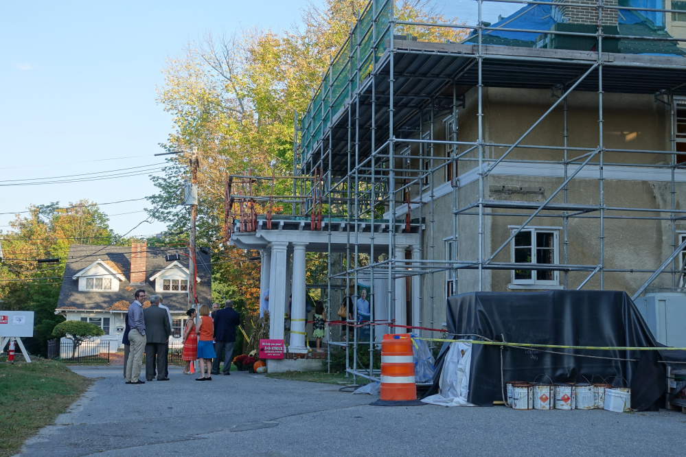 Kennebec Valley Chamber of Commerce Business After hours attendees enter the Gannett House through the newly restored side portico doors while building envelope restoration continues.