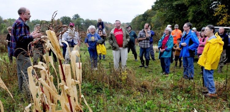 Starks Third Selectman Ernie Hilton welcomes people to the town's Indigenous Peoples Day celebration at the Sweet Land farm in Starks on Monday. The group learned native American farming practices.