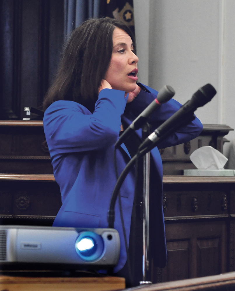 Kennebec and Somerset County District Attorney Maeghan Maloney illustrates being choked as she gave closing arguments to the jury in the domestic violence case against Andrew Maderios in Somerset County Superior Court in Skowhegan on Sept. 4, 2015.