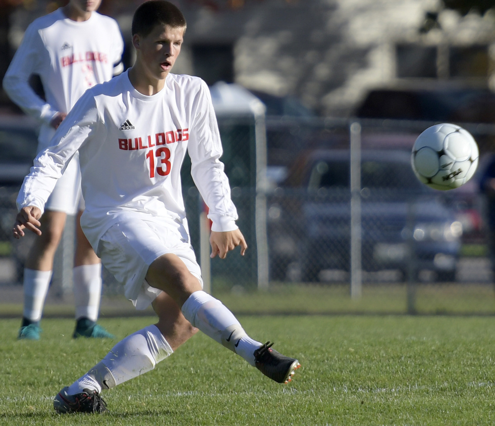 Hall-Dale's Matt Albert boots the ball during a game Tuesday against Mt. Abram in Farmingdale.