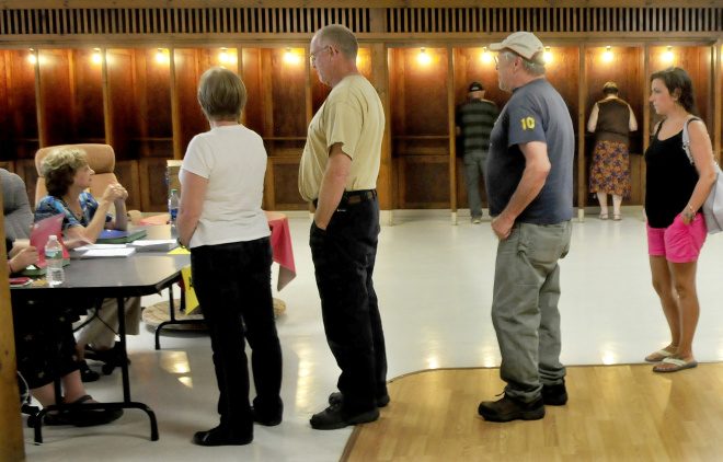 Voters will line up again Oct. 24, as they did here on Sept. 11, to cast their ballots for a fourth time for the Regional School Unit 9 school budget at the Community Center in Farmington. Residents approved a $33.63 million budget Wednesday night at the Mt. Blue campus gymnasium.