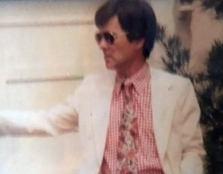 J.P. Devine wears sports aviator-style sunglasses in an earlier day.