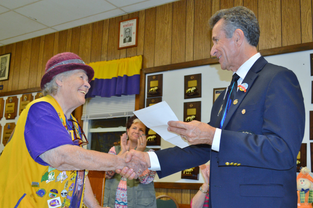 Mary Follett, left, accepts 30 year service award from District Governor Norman Hart as Whitefield Lions Club President Cindy Haskell Lincoln looks on.