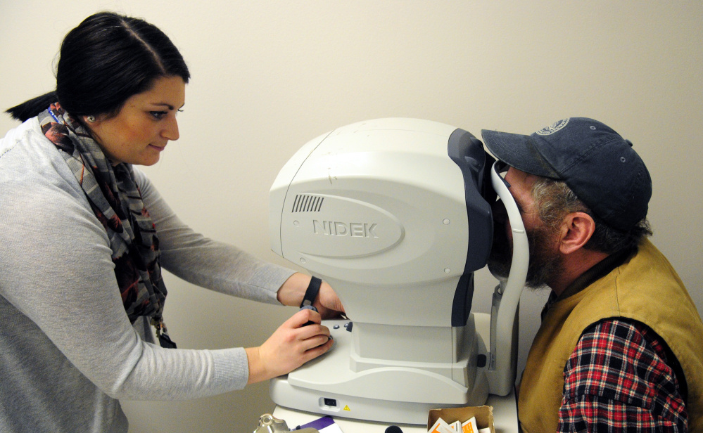 Marie Mantelli, left, does an eye exam on Rob Gaston, of Waldoboro, during the 18th annual Homeless Veterans Stand Down on Oct. 17, 2015 at VA Maine Healthcare Systems-Togus.