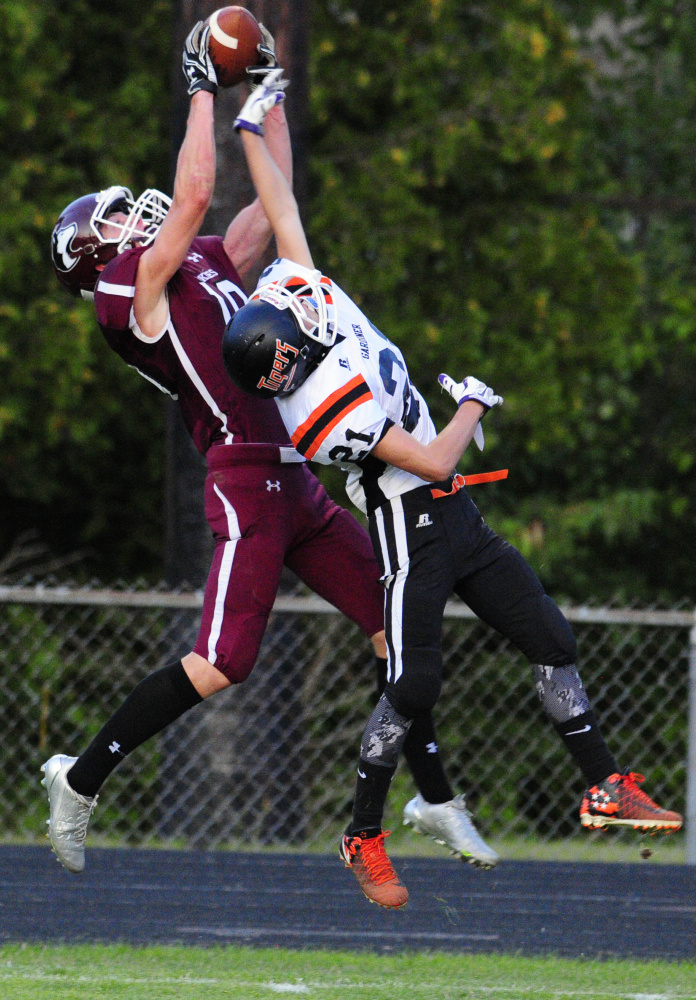 Gardiner defensive back Blaise Tripp plays defense and causes MCI tight end David Young to drop the pass during an exhibition game Aug. 25 at Hoch Field in Gardiner.