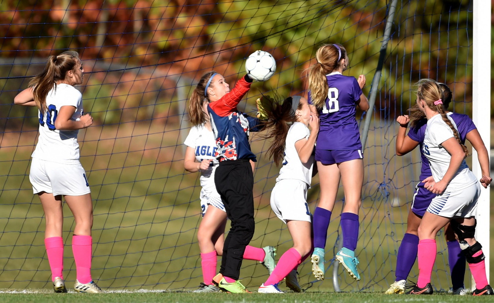 Erskine goalie Taylor Shute makes a save on a corner kick during a Class B North game against Waterville last Friday in South China.