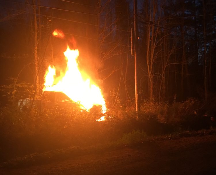 A pickup truck took out a utility pole and burst into flames Sunday evening on the Red Bridge Road. The driver fled on foot but turned himself in Monday to the Skowhegan police.
