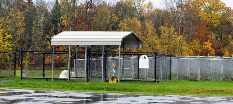 An area behind the Humane Society Waterville Area is where dogs frequently are walked and penned outdoors by owners and volunteers. Danielle Jones, of Winslow, owner of two pit bull dogs that have been ordered to be euthanized, said the dogs escaped Tuesday while she was walking them.
