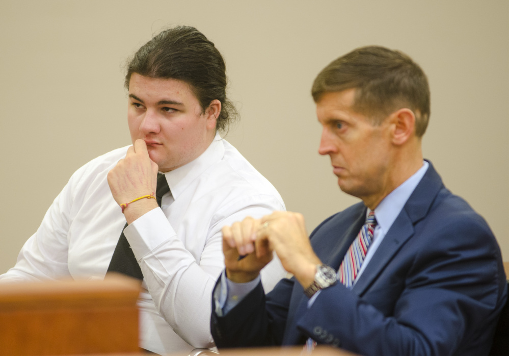 Andrew Balcer, 18, left, sits with his attorney, Walter McKee, during a hearing Thursday at Capital Judicial Center in Augusta, where a judge will determine whether he should face trial on double murder charges as an adult.