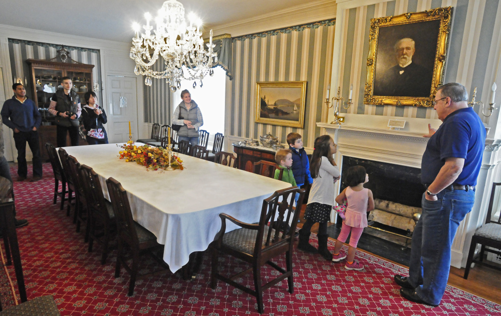 Gov. Paul LePage points out a picture of James G. Blaine while leading a tour of the governor's mansion during the Blaine House Food Drive on Nov. 7, 2015 at the Blaine House in Augusta.