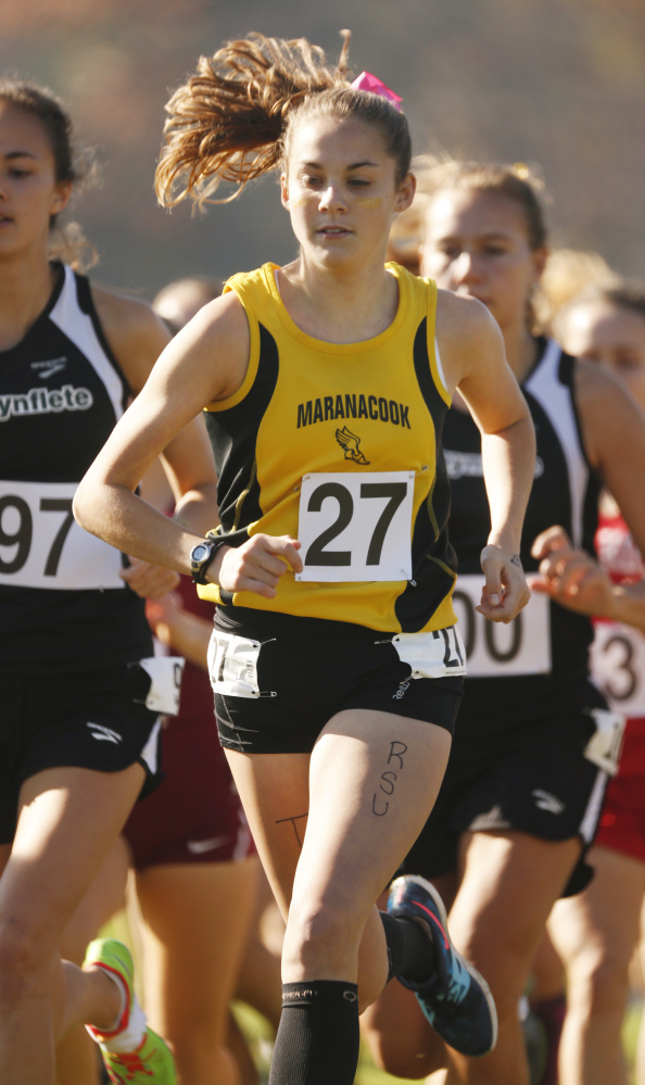 Maranacook's Molly McGrail (27) runs in the pack at the start of the Class C cross country state championship meet Saturday at Twin Brooks Recreation Area in Cumberland.