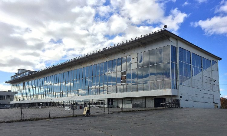 Clouds are reflected in the grandstand windows at Scarborough Downs last year. Town officials are proposing the racetrack site as a contender for Amazon’s new facility, which would eventually employ as many as 50,000 people